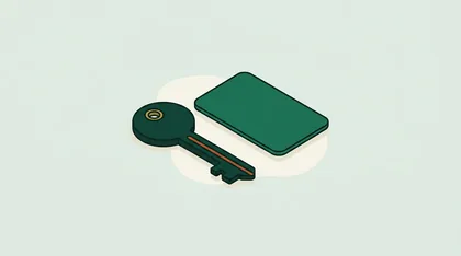 Door key lying beside a blank entry card